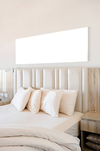 Hotel room interior with blank white frame for mockup design